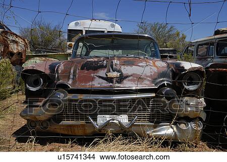 Picture - sits, junkyard, desert, abandoned, cadillac. Fotosearch