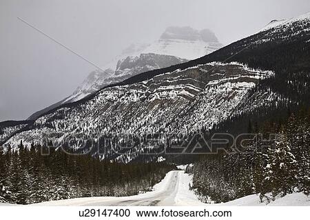 snow, highway, winter, mountains, rocky, road View Large Photo Image Stock Image - snow, highway, winter, mountains, rocky, road. Fotosearch