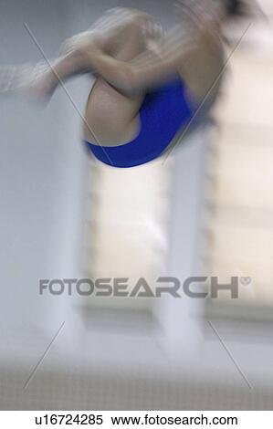 Stock Photography - somersault, woman, diving, competitor, female, college. Fotosearch