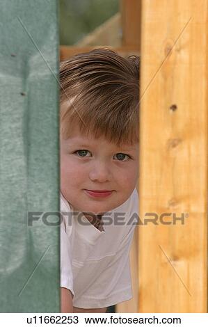 Stock Image - southern, boy, scenic, out, peaking, young. Fotosearch