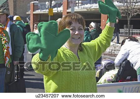 Stock Photo - st, female, mittens, shamrock, wearing, woman. Fotosearch