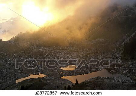 Stock Photo - sun, lakes, subalpine, setting, view. Fotosearch