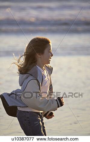 Stock Photo - usa, enjoying, florida, scenic, beach, boy. Fotosearch
