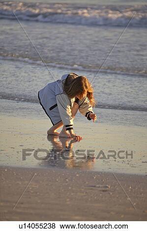 Stock Photo - usa, enjoying, florida, scenic, beach, girl. Fotosearch