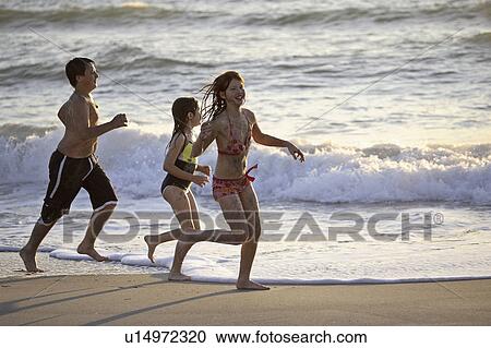Stock Image - usa, kids, florida, beach, enjoying, children. Fotosearch