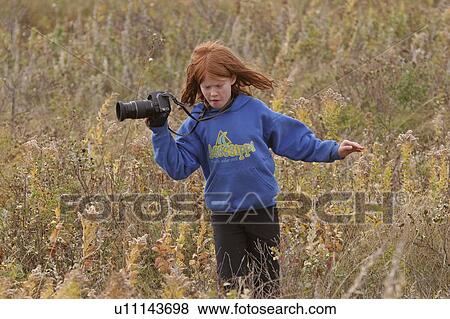 Stock Photo - weyburn, photographer, weeds, grass, tall, young. Fotosearch