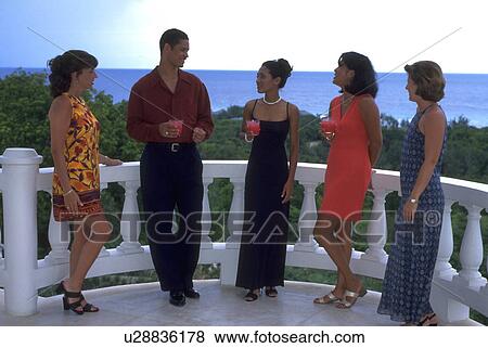Stock Photo - women, cocktail, young, four, reception, relaxed. Fotosearch