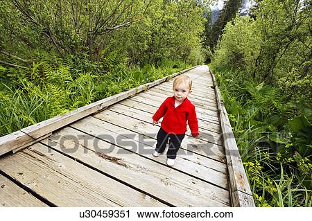 Stock Image - wooden, released, walking, girl, young, model. Fotosearch