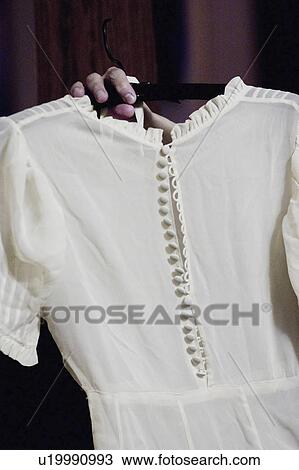 Stock Image - worn, up, dress, wedding, moms, holding. Fotosearch