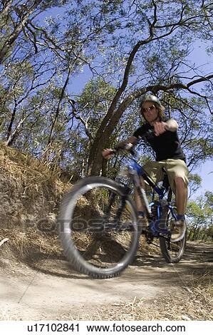 Stock Image - young, through, riging, male, active. Fotosearch