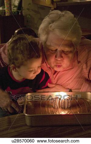 Stock Image - age, out, candles, birthday, grandmas, blowing. Fotosearch