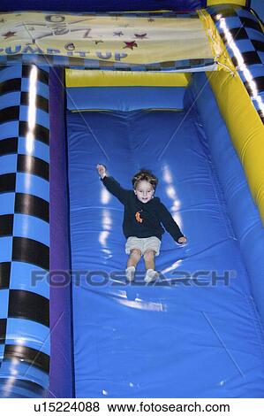 Stock Photo - age, up, pump, sliding, boy. Fotosearch