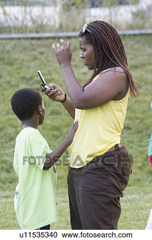 american, cell, making, mom, african View Large Photo Image Stock Image - american, cell, making, mom, african. Fotosearch