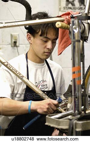 Stock Photo - bicycle, american, repair, making, worker, asian. Fotosearch