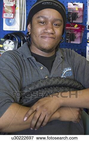bike, holding, express, youth, tires, worker View Large Photo Image Stock Photo - bike, holding, express, youth, tires, worker. Fotosearch