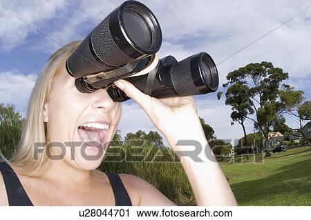 Stock Image - binoculars, female, pair, large, searching, woman. Fotosearch