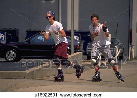 Stock Image - blading, young, roller, males, men, two. Fotosearch