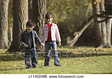 Stock Photograph - canada, holding, saskatchewan, scenic, hands, siblings. Fotosearch
