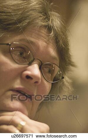 Stock Image - conversation, female, engaged, 59, age, woman. Fotosearch