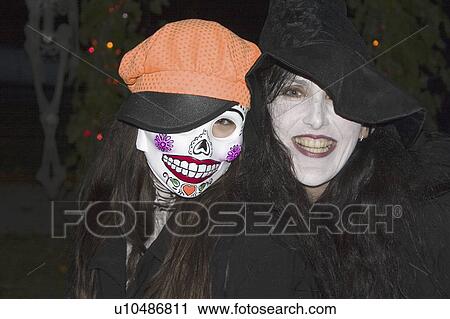 Stock Image - costumes, dressed, ghoul, witch, halloween, teenagers. Fotosearch