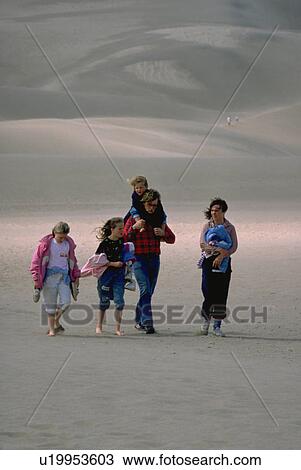 Stock Image - couple, dune, colorado, park, national, great. Fotosearch