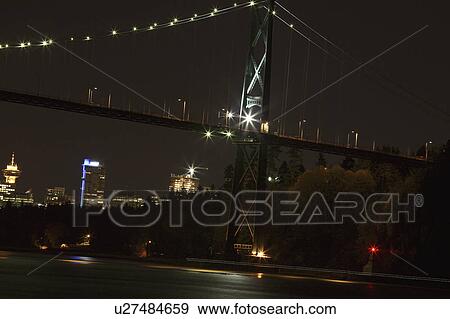 Stock Photo - downtown, lights, bridge, gate, lions, night. Fotosearch