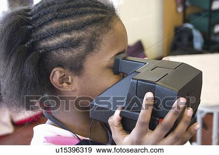 Stock Photo - express, photographing, youth, camera, polaroid, girl. Fotosearch