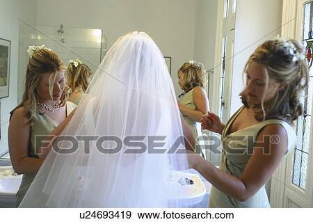 Stock Photo - family, maids, wedding, bride, prepare, brides. Fotosearch