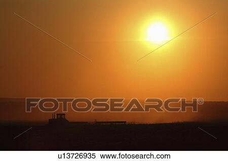 Stock Photography - fields, setting, working, farming, behind, sun. Fotosearch