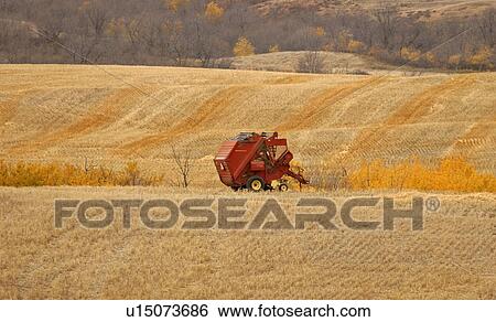 Stock Photograph - finished, left, baling, harvest, field, baler. Fotosearch