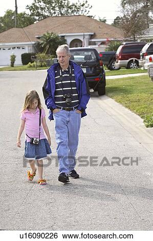 Stock Photograph - florida, daughter, scenic, stroll, taking, father. Fotosearch