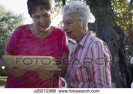 Stock Photo - funeral, friend, document, family, look, sister. Fotosearch