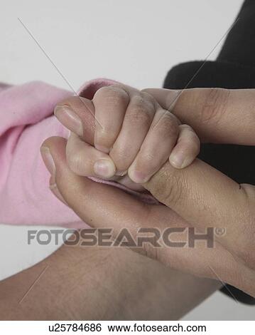 girl, thumb, fathers, holding, little View Large Photo Image Stock Photograph - girl, thumb, fathers, holding, little. Fotosearch