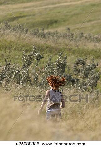 grass, girl, tall, through, running, young View Large Photo Image Stock Photograph - grass, girl, tall, through, running, young. Fotosearch