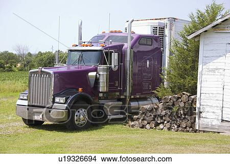 Picture - hit, purple, ready, woodpile, truck, parked. Fotosearch