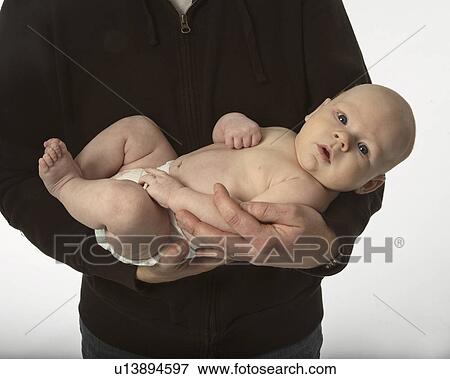 Stock Photo - holding, baby, father, arms, fathers, small. Fotosearch
