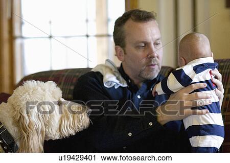 Stock Image - holding, eye, watchful, infant, father. Fotosearch