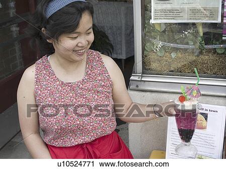 Stock Image - holding, woman, 22, age, female, asian. Fotosearch