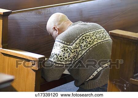 Stock Image - kneeling, gogebic, bench, writing, male. Fotosearch