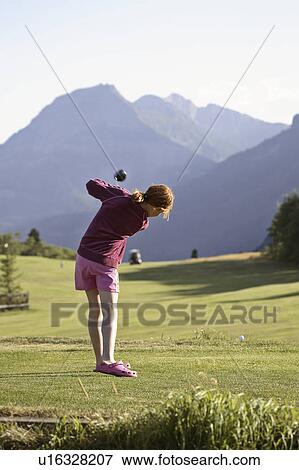 Stock Photo - lakes, golfer, course, golf, waterton, young. Fotosearch
