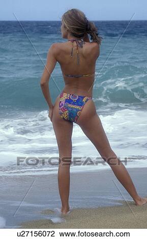 Stock Image - lookin, standing, beach, figure, full, model. Fotosearch