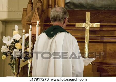 Stock Image - lutheran, praying, vining, altar, facing, minister. Fotosearch