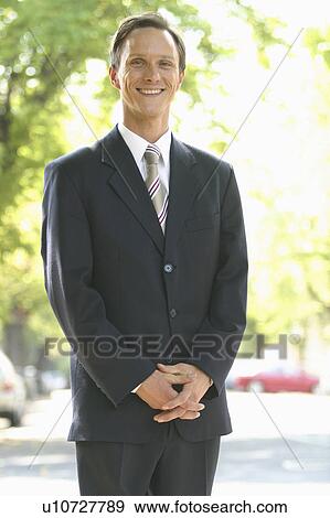 male, standing, suit, happy View Large Photo Image Stock Photo - male, standing, suit, happy. Fotosearch