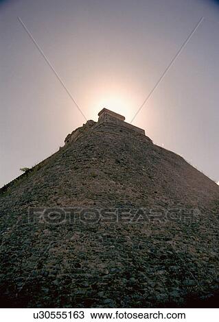 Stock Image - mexico, silhouettes, uxmal, magician, pyramid, sun. Fotosearch