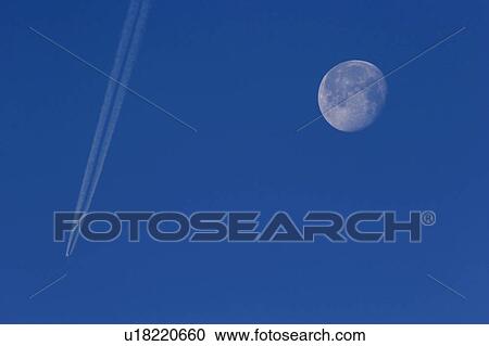 Stock Image - moon, plane, full, past, flying, jet. Fotosearch