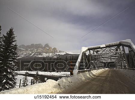 Picture - mountain, covered, bridge, leading, road, snow. Fotosearch