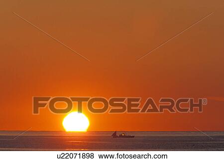 Stock Photo - off, atlantic, sunshine, ocean, boating, red. Fotosearch