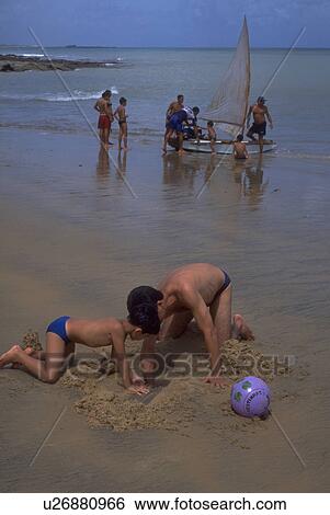 Stock Photograph - play, fortaleza, beach, together, father. Fotosearch
