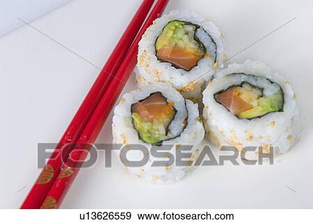 Stock Photo - rice, makizushi, seaweed, one, chopsticks, three. Fotosearch