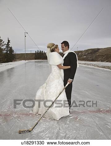 Stock Image - rink, groom, outdoor, skate, ice, bride. Fotosearch